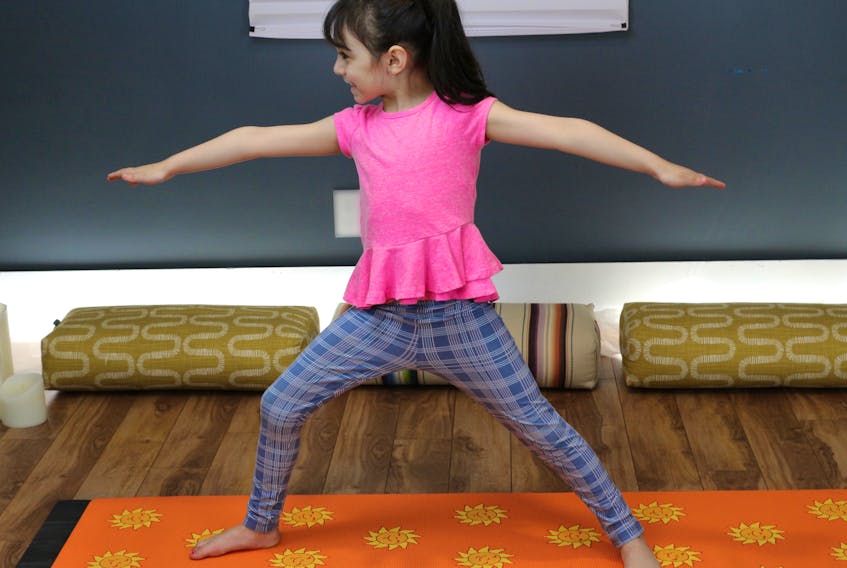 Cut: (one cut for all pix; put them side by side)

Children do enjoy yoga and its benefits are numerous. Some of the poses include Warrior II, seated forward fold, seated meditation and savasana/relaxation. CONTRIBUTED 
