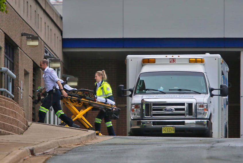 In this file photo, an EHS ambulance crew arrives with an empty stretcher at the Halifax Infirmary. The provincial government recently announced a one-year pilot project to free up ambulances and paramedics by providing three passenger vans for non-emergency transportation of people between health-care facilities. Tim Krochak / SaltWire Network