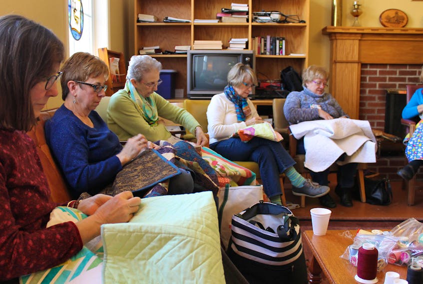Members of the Mahone Bay Quilters Guild hand sew binding on cuddle quilts destined for the IWK Health Centre in Halifax.  The group has donated 1,500 quilts over the past 13 years and typically comes together for a day to make the blankets. Because of COVID-19, that wasn't possible this year, so instead members shared pictures of their work via Facebook. In all, 37 of the members finished 116 quilts or tops during the day for the IWK NICU.