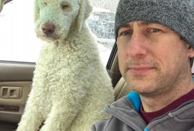 Nova Scotia veterinarian Dr. Alex Hare with his faithful companion, Billy.