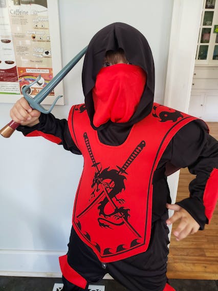 Seven-year-old Max Yorke of Kentville, N.S. is dressing as a ninja this year for Halloween. As his mother Gillian says, this costume already has a conveniently built-in mask, and is actually required to play the part.