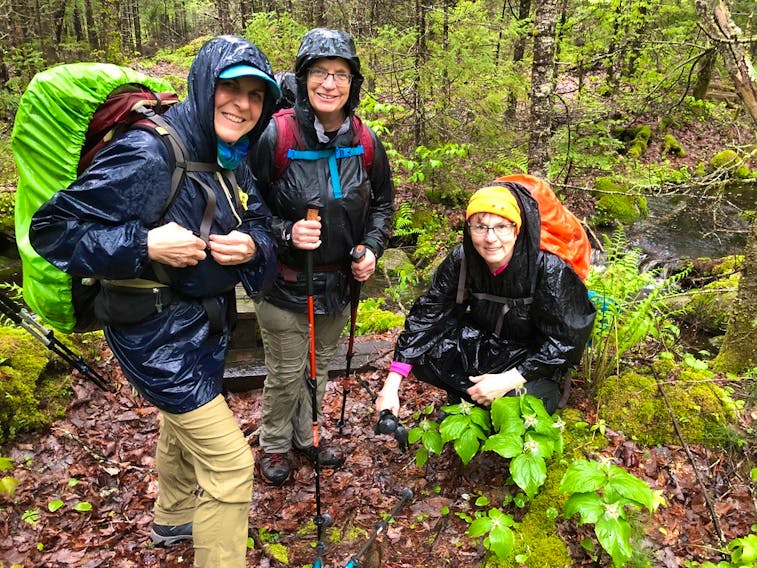Janice Rand (from left)  Cindy Graham  and Nancy Veinot pose for a photo while hiking the Liberty Lake Trail in Kejimkujik National Park in preparation for a six-day hike on the Appalachian Trail in 2019. Also on the hike was Karen Toews. Contributed 

