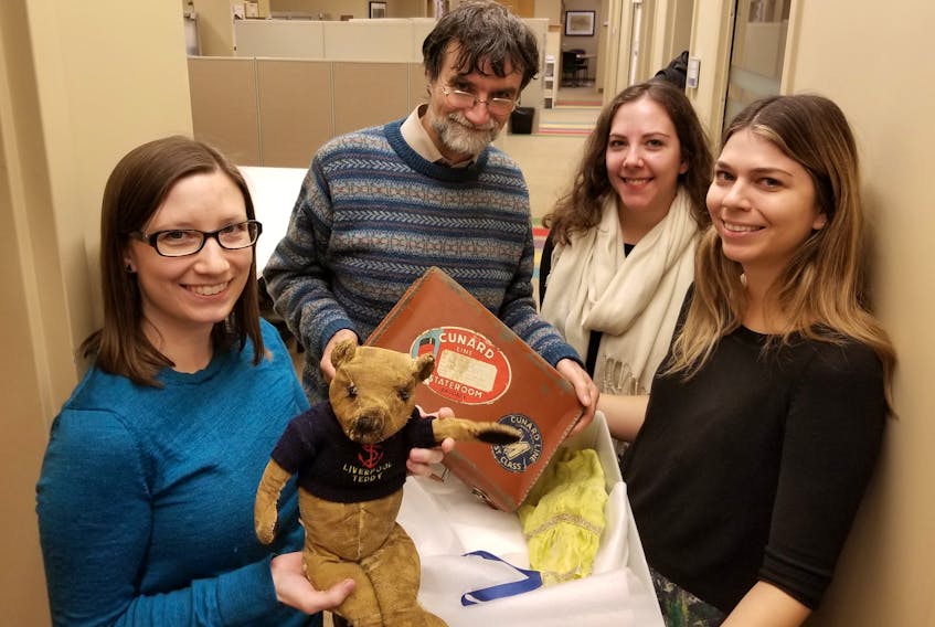 Teddy is shown on his arrival to Pier 21 with museum staff. Pictured, from left, are collectors coordinator Sarah Little, curator Dan Conlin, collections cataloguer Sabrina Orr, and collection manager Tanya Higgins.