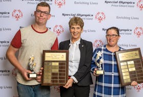 Joan Dennis of P.E.I. Mutual Insurance Co. congratulates two of Special Olympics P.E.I.’s major award winners for the 2018-19 season. Roy Paynter was named the male athlete of the year and Erin Pippy was presented with the female athlete of the year award. P.E.I. Mutual sponsored both awards, which were presented in Charlottetown recently.