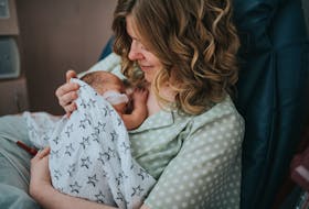 Local artist Rebecca Cohoe, shown in the neonatal intensive care unit with her newborn son, Ray, around Mother's Day 2019, was inspired to co-organize #FrontlineFacesNL partly as a way to say thank you to health-care workers who cared for her family. Photo by Amanda Dinn Photography