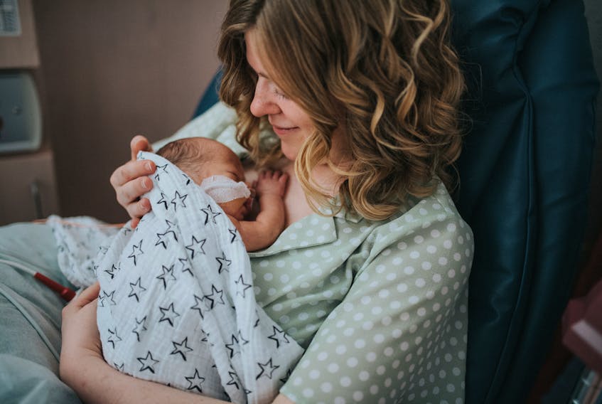 Local artist Rebecca Cohoe, shown in the neonatal intensive care unit with her newborn son, Ray, around Mother's Day 2019, was inspired to co-organize #FrontlineFacesNL partly as a way to say thank you to health-care workers who cared for her family. Photo by Amanda Dinn Photography