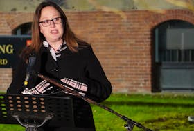 Trish Altass, shown in a file photo speaking at a rally outside the Coles Building, chaired an all-party special committee on poverty that has recommended the federal and provincial governments partner to implement a basic income guarantee on P.E.I.