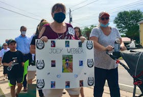 Hundreds of people joined the mass shooting victims' families on a march to the RCMP detachment in Bible Hill on Wednesday, July 22, 2020.
