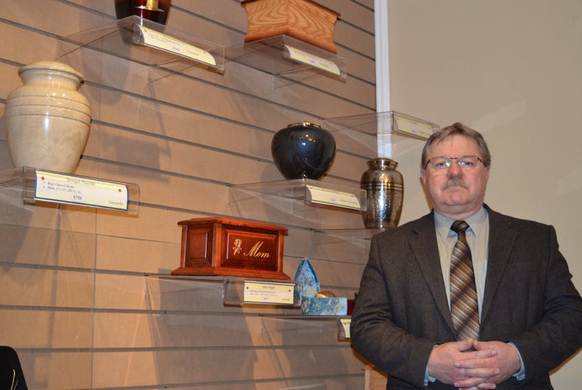 Kevin Gallant, owner of Hennessey Cutcliffe Charlottetown Funeral Home, displays containers designed to hold the ashes of a loved one. He said that with the demand for cremations rising, the funeral home decided to put in its own crematorium. It’s been in operation for the past week. DAVE STEWART/THE GUARDIAN