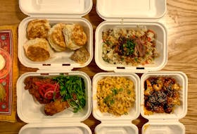 The weekly offerings for takeout at Seto change often, but their vegetable fried rice is a staple menu item, pictured here with roast duck on top. 