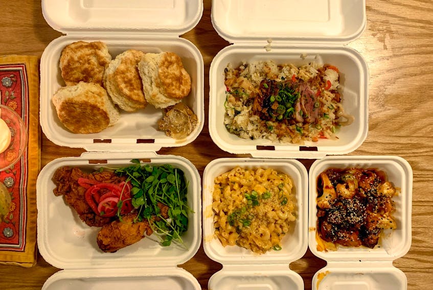 The weekly offerings for takeout at Seto change often, but their vegetable fried rice is a staple menu item, pictured here with roast duck on top. 