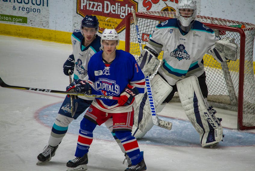 Edmundston Blizzard defenceman Keenan Gillis looks to prevent Summerside Western Capitals forward Austin Taylor from screening goaltender Francis Asselin during Game 2 of the best-of-seven Eastlink North Division final series in the MHL (Maritime Junior Hockey League). Olivier Chiasson Photo