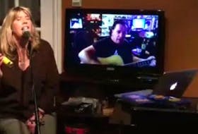 Jenn Sheppard, centre, of New Waterford, performs during a recent "garbage night" live streamed on Facebook with daughter Jordyn Crocker, left, and husband Stephen Muise. Last Thursday the event raised more than $14,000 for iPads for seniors in nursing homes. CONTRIBUTED