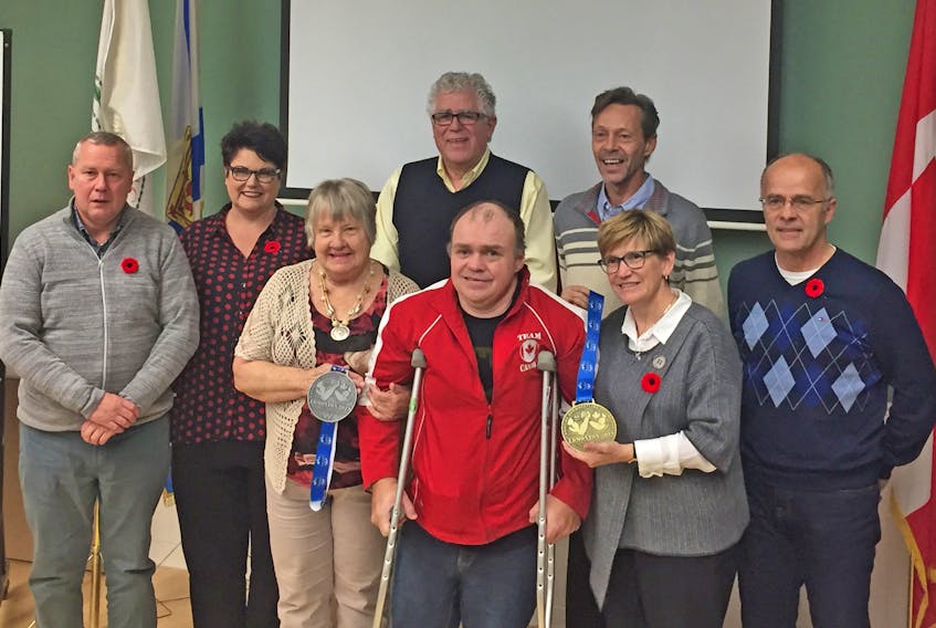 Veteran arm wrestling athlete Garry Kell visited the Town of Antigonish council’s monthly meeting Oct. 28. Here, with his medals from the 2019 Canadian championships in hand, he poses for a photo with Mayor Laurie Boucher and councillors. Corey LeBlanc