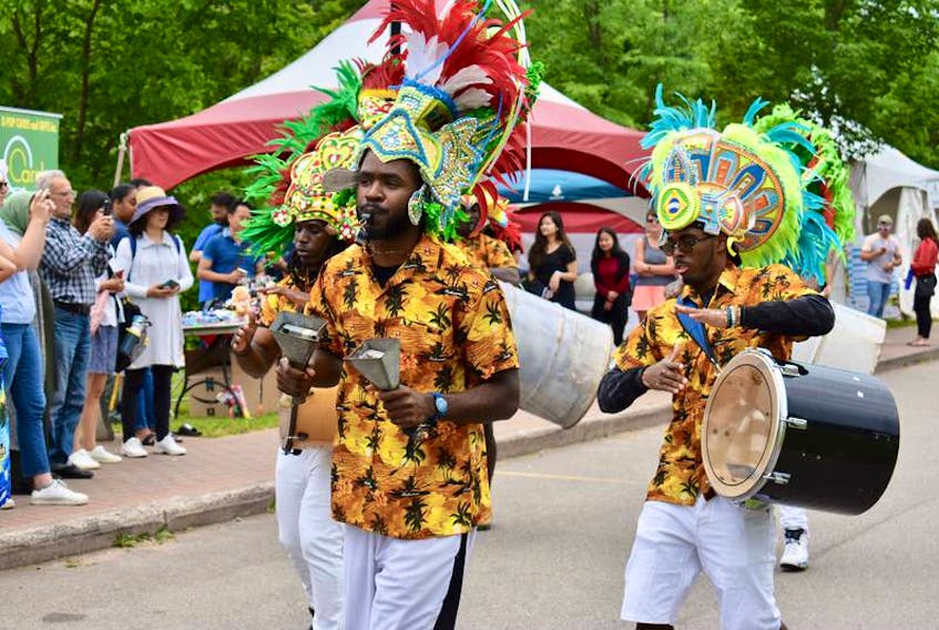 Members of the Rush Bohemian Jonkanoo band march along the Montague waterfront during the DiverseCity Multicultural Festival held in Three Rivers in July 2019. The event was part of the larger Montague Summer Days Festival.