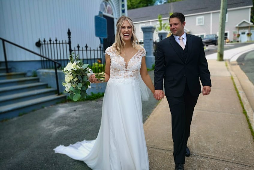 Newlyweds Tara and Richard Barry, after their wedding at the Wesley United Church on Saturday. – Andrew Waterman/The Telegram