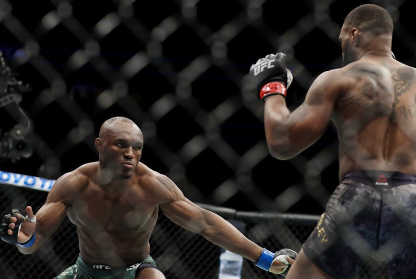 Tyron Woodley and Kamaru Usman, of Nigeria, fight during their welterweight title bout during UFC 235 at T-Mobile Arena on March 02, 2019 in Las Vegas, Nevada. 