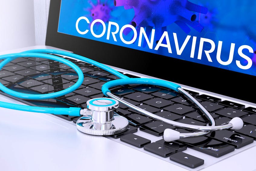 stethoscope on laptop keyboard with screen showing coronavirus