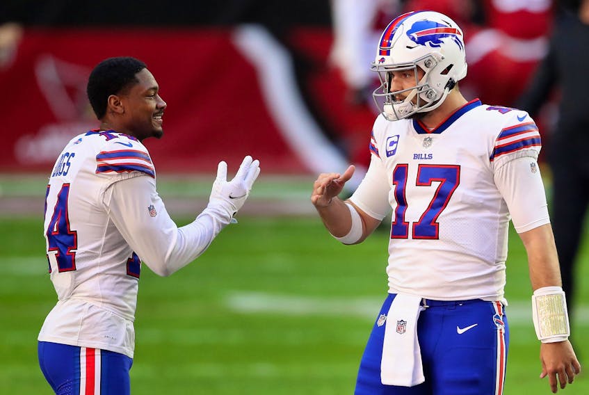 Quarterback Josh Allen #17 and wide receiver Stefon Diggs #14 of the Buffalo Bills talk before the NFL game against the Arizona Cardinals at State Farm Stadium on November 15, 2020 in Glendale, Arizona. 
