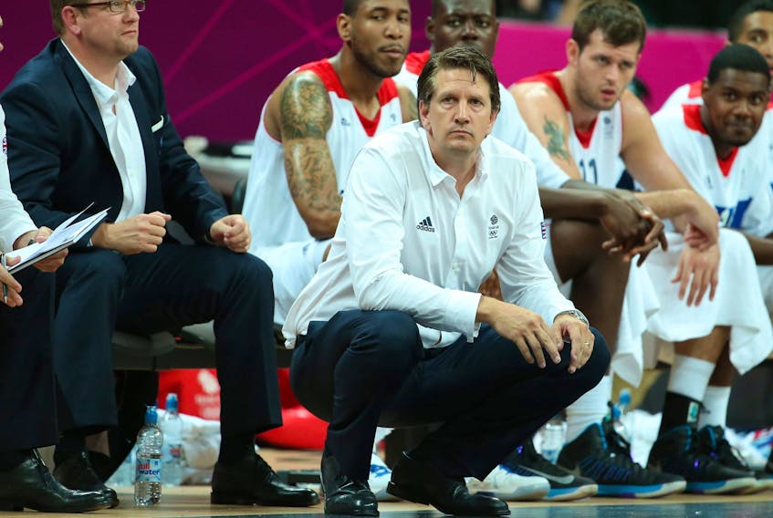 Great Britain coach Chris Finch looks on with Nick Nurse (left) at a men’s basketball preliminary-round match for the London 2012 Olympic Games. 
