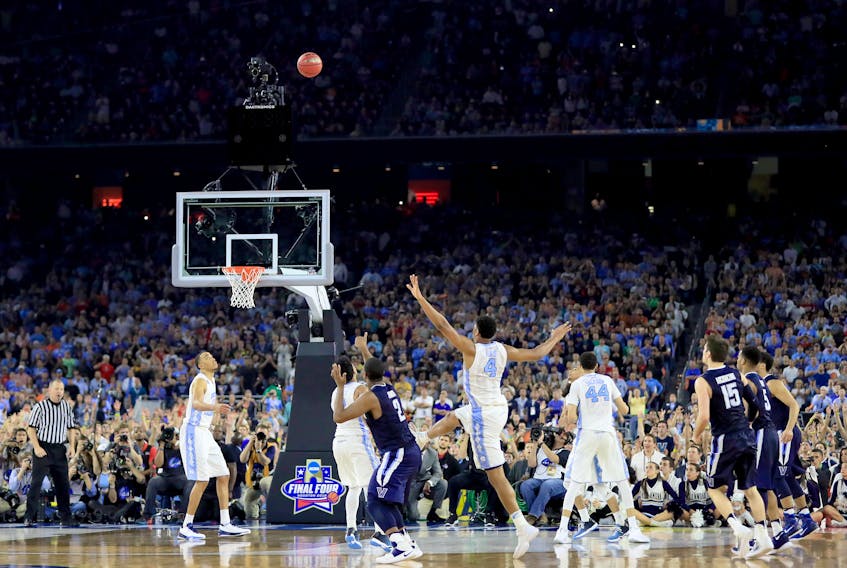 Kris Jenkins of the Villanova Wildcats shoots the game-winning three pointer to defeat the North Carolina Tar Heels 77-74 in the 2016 NCAA Men's Final Four National Championship game at NRG Stadium on April 4, 2016 in Houston, Texas.  (Photo by Ronald Martinez/Getty Images)