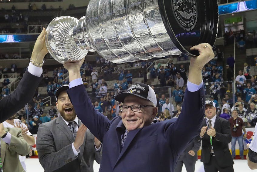 General manager Jim Rutherford holds up the Stanley Cup after his Penguins knocked off the San Jose Sharks in Game 6 three years ago. Rutherford has been GM of three Cup-winners, two in Pittsburgh and one in Carolina.                                                          
 Bruce Bennett/Getty Images