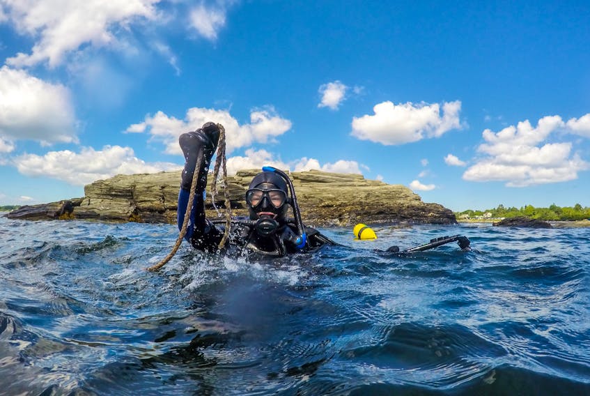 Alexa Goodman, project manager for the Coastal Action group of Nova Scotia, takes a dive for lost fishing gear off Southwest Nova Scotia.