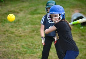 Faith Turner keeps her eye on the wiffle ball during West Royal under-12 girls' softball practice Monday in Charlottetown.