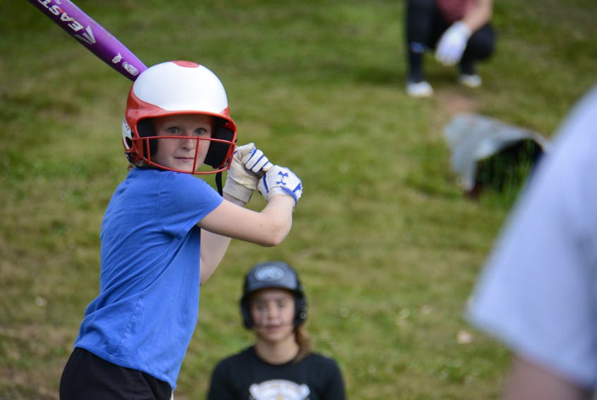 Anna MacLeod waits for a pitch during batting practice Monday at Queen Charlotte field in Charlottetown.
Jason Malloy/The Guardian
