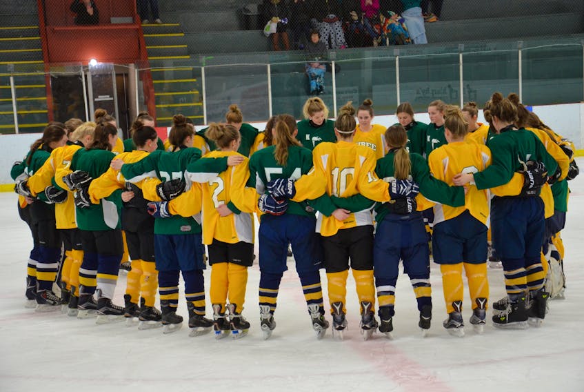 A very touching moment took place following the girls’ championship game of the Kensington Intermediate-Senior High School invitational high school hockey tournament at Credit Union Centre in Kensington, formerly Community Gardens, on Saturday afternoon. The Three Oaks Axewomen and KISHORA, a combined team of Kensington Intermediate-Senior High and Kinkora Regional High School, gathered at centre ice, stood with arms around each other and observed a moment of silence and prayer for the victims of the Humboldt Broncos bus crash in Saskatchewan on April 6. It was noted the two teams were wearing the Broncos’ team colours – green (KISHORA) and yellow (Three Oaks). The Axewomen had just defeated KISHORA 3-0 in the final.