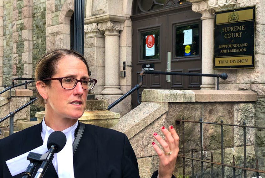 St. John's lawyer Rosellen Sullivan speaks to reporters outside Newfoundland and Labrador Supreme Court Tuesday afternoon. Sullivan, representing the Canadian Civil Liberties Association, is seeking legal standing in a constitutional challenge to the province's COVID-19-related special health measures. Justice Donald Burrage will rule on the application Wednesday.