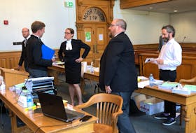 Lawyers on both sides of a constitutional challenge to the Government of Newfoundland and Labrador's COVID-19-related travel ban — Mark Sheppard, Justin Mellor and Don Anthony for the province, John Drover for complainant Kim Taylor and Rosellen Sullivan, for the Canadian Civil Liberties Association — are shown during a break in the hearing in Newfoundland and Labrador Supreme Court Tuesday.