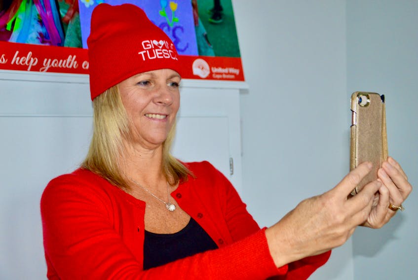 United Way of Cape Breton executive director Lynne McCarron takes an un-selfie — a photo of yourself if you’re involved in Giving Tuesday or just helping others during this holiday season. ELIZABETH PATTERSON • CAPE BRETON POST