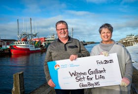 Wayne Gallant and his wife, Lois, are all smiles as they collect their winnings from an Atlantic Lottery Set for Life Scratchn'Win lottery ticket.  - CONTRIBUTED