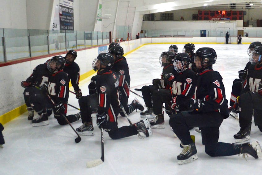 Members of the Glace Bay Miners under-15 ‘A’ hockey team wait to take part in a drill during team practice and the Dominion Arena on Wednesday. The club will be one of 14 Glace Bay teams donating to the Christmas Crew program this weekend. JEREMY FRASER • CAPE BRETON POST