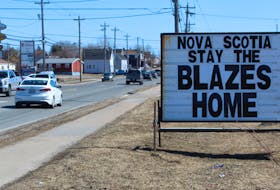 People driving along Reserve Street in Glace Bay are reminded to "stay the blazes home," thanks to this sign. Since Nova Scotia Premier Stephen McNeil first said these words during a daily COVID-19 update, the phrase has become a viral sensation with memes, mugs and T-shirts used to pass the message along. NICOLE SULLIVAN/CAPE BRETON POST 