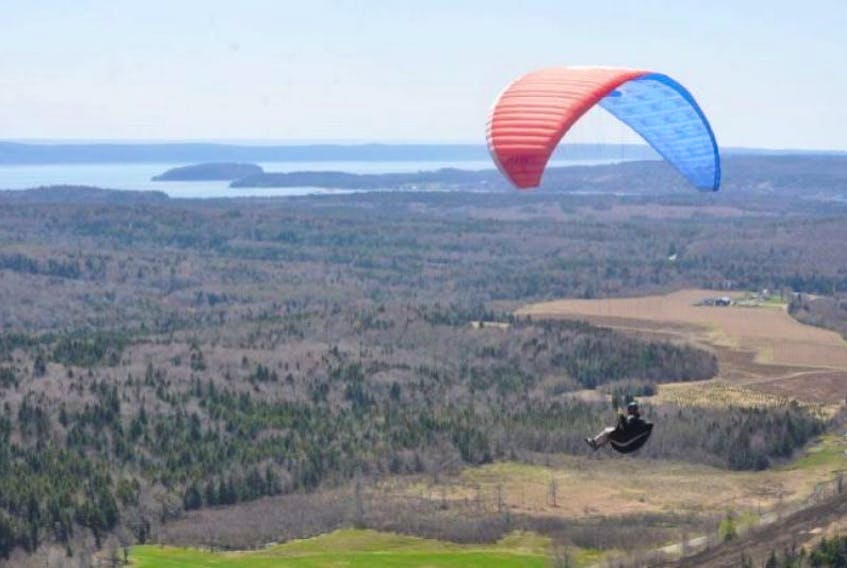 Paragliding pilot Patric Stettler enjoys a flight at Hidden Falls near Parrsboro on Friday, May 16, as the 20th annual Festival of Free Flight kicked off.