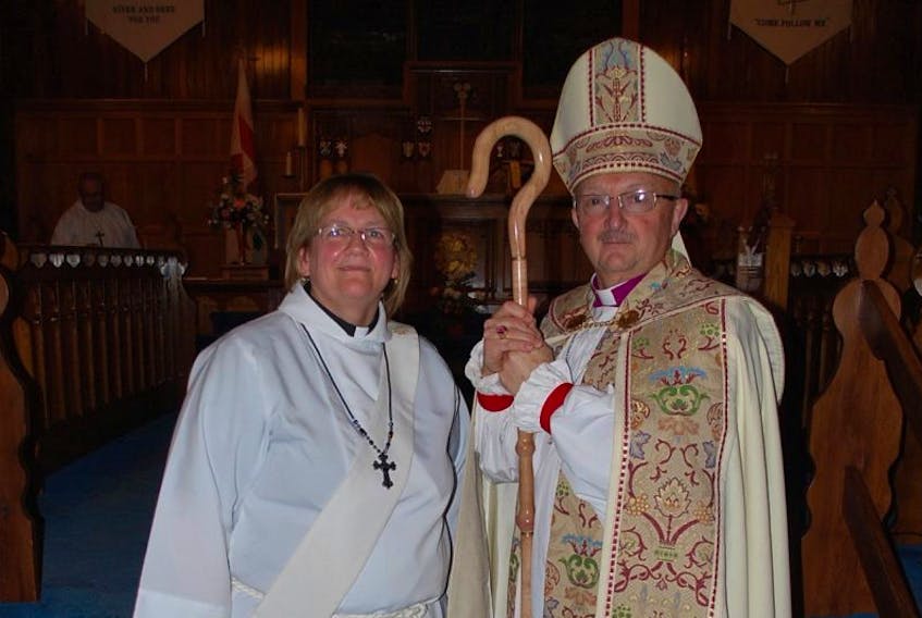The Rev. Kay Short and Archbishop Percy Coffin posed for a photo after her ordination as deacon to the Anglican Church on Dec. 8.