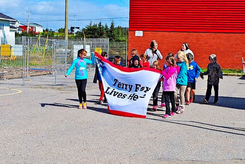 Students at LeGallais Memorial School in Isle aux Morts participated in a Terry Fox Run on Sept. 25. Kelsey Fagan and Caliegh Keeping carried the banner.