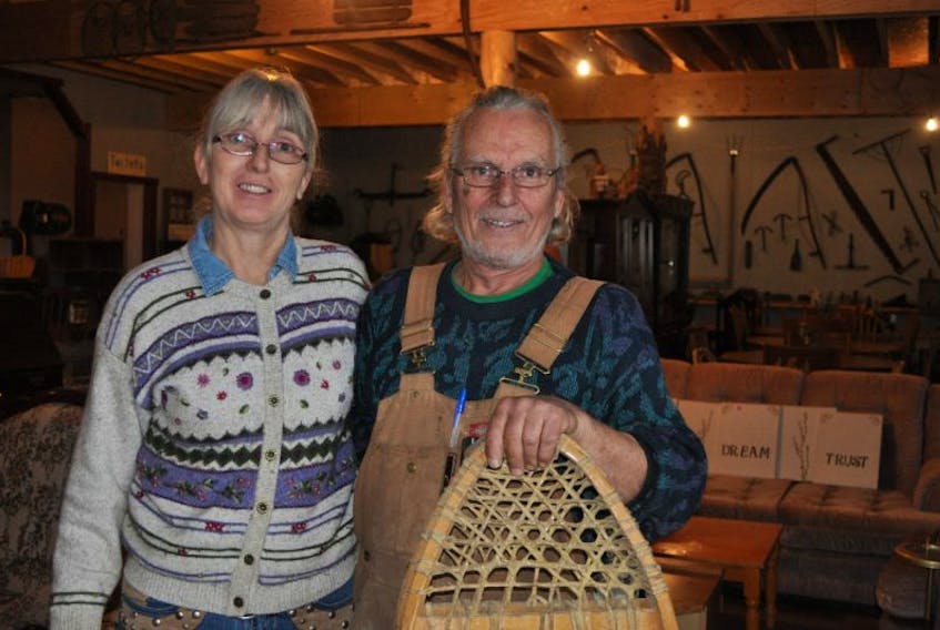 Jane Rioux and Melvin Hibbs are pictured inside Camp 22 Melvin's Dream lodge, the main hub of the future camping development.