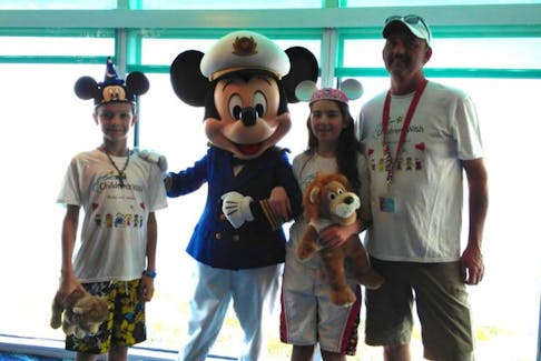 Chloe Allen posed with her little brother Ethan, Capt. Mickey Mouse and her father Darren aboard the Disney Dream. Chloe was granted a wish by the Children's Wish Foundation and got a trip to Disney World and a cruise.