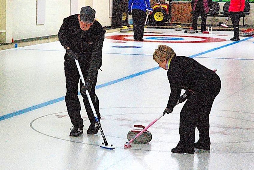 The Gateway Curling Club hosted the Jeans Memorial Bonspiel on March 11 and 12. Russell Penney and Carol Cote were among the curlers on the ice at the club.