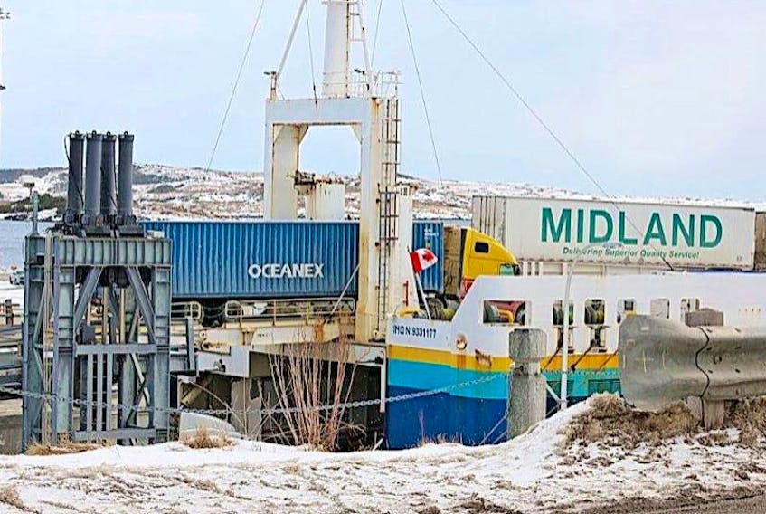 A truck hauling an Oceanex cargo container is loaded onto a Marine Atlantic ferry in Port aux Basques on March 12. Oceanex has made an application to the Federal Court of Canada for a review of Marine Atlantic’s commercial freight rates.