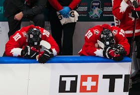 Dejected members of team Canada sit on the bench after being defeated by the United States in the IIHF world junior championship gold-medal game on Tuesday, Jan. 5, 2021, in Edmonton.