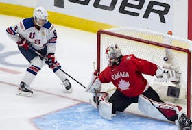 Canada's goalie Devon Levi is scored on by the United States' Trevor Zegras (9) in the IIHF world junior championship gold-medal game on Tuesday, Jan. 5, 2021 in Edmonton.
