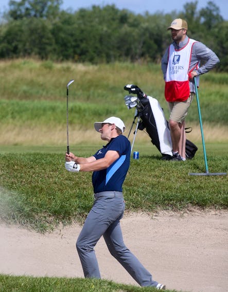 Myles Creighton hits out of a bunker while his caddy looks on during the second round of the Jacksonville Championship, Sept. 24 in Jacksonville, Fla.  PGA TOUR