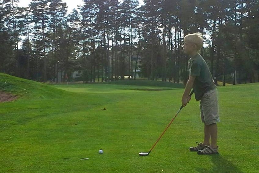 <p>Ashton Gennette, Kentville, gets a private golf lesson at the KenWo Golf Club. Ashton, who has been golfing for over a year, loves learning the new sport. - Submitted</p>