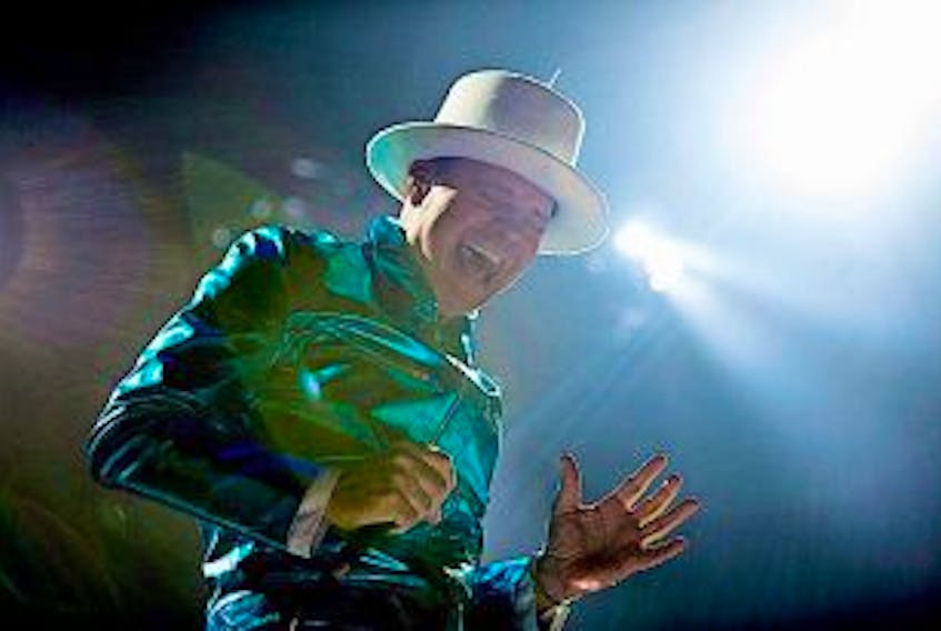 ['<p>Frontman of the Tragically Hip, Gord Downie, leads the band through a concert in Vancouver, Sunday, July, 24.</p>']