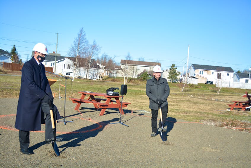 Maj. Rene Loveless (left), public relations and development secretary with the Salvation Army Newfoundland and Labrador, and Derek Bennett, minister of environment, climate change and municipalities, plunge the first official shovels into the area where the church’s new garage will be built. Nicholas Mercer/SaltWire Network
