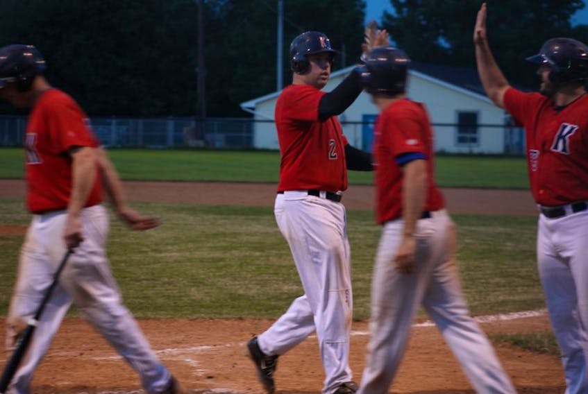 Kyle Dougan of the Kentville senior Wildcats is congratulated by his teammates&nbsp;following his grand slam home run in the fourth inning, the big hit in Kentville's 13-3 win over Truro. Dougan had five RBIs on the night to lead Kentville to just its second win of the&nbsp;season.&nbsp;